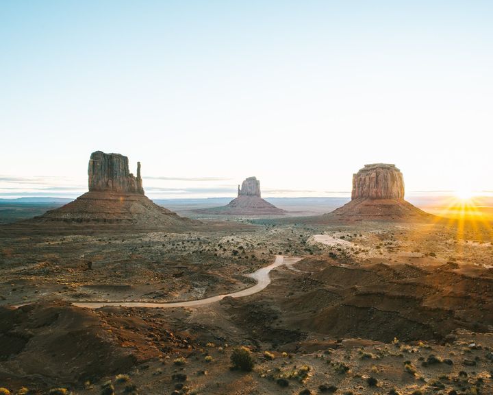 Sandstone buttes of Monument Valley at sunrise